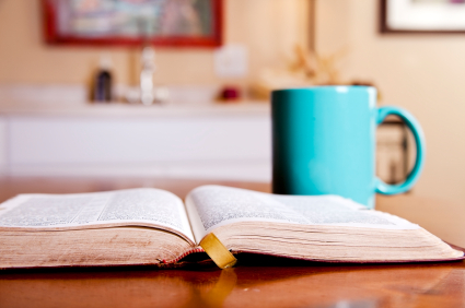 Bible and mug on table